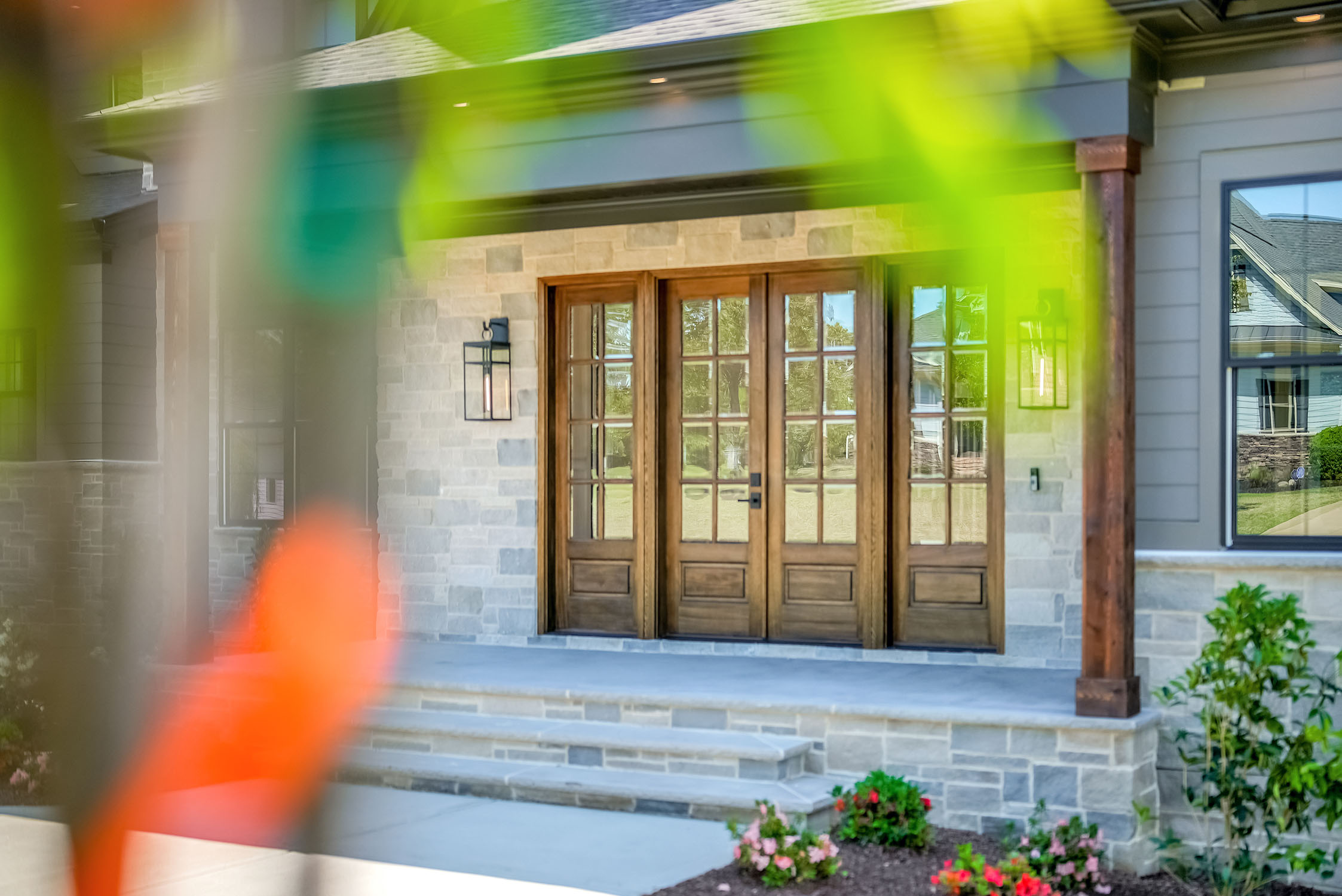 Modern home entrance with wooden double doors