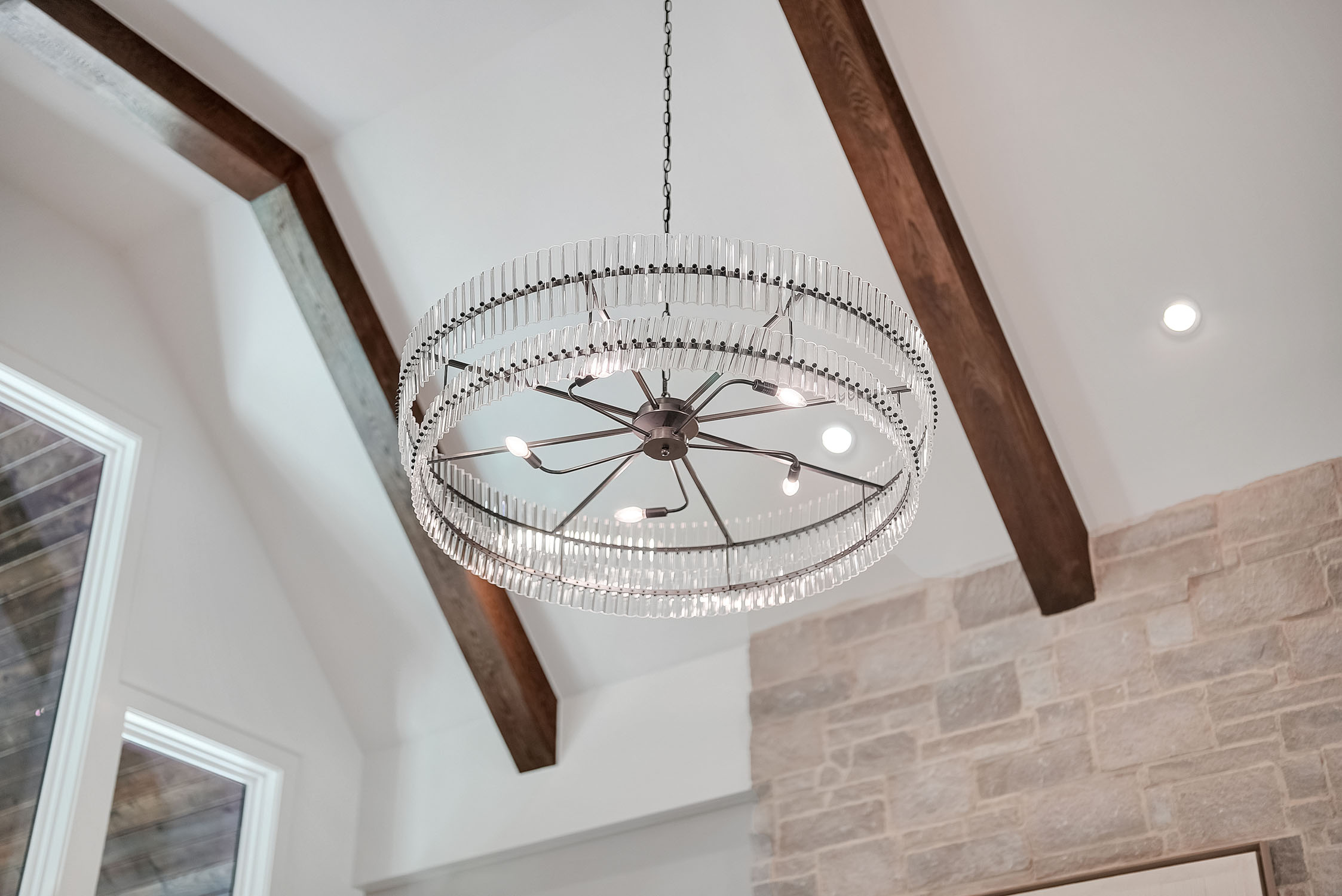 Modern circular chandelier with glass rods and bulbs