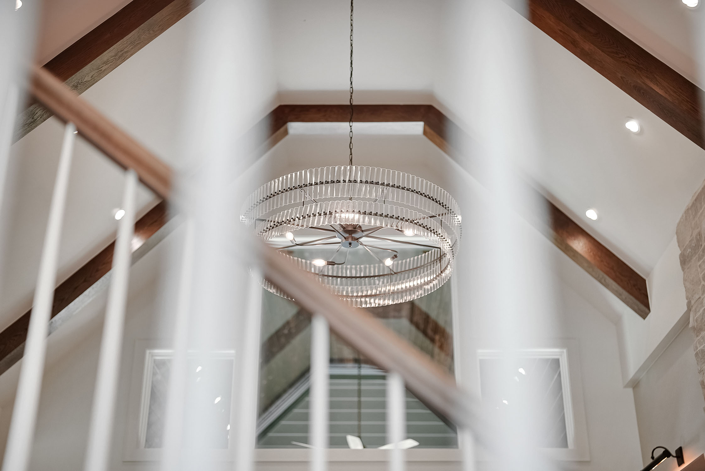 Modern chandelier in vaulted ceiling foyer