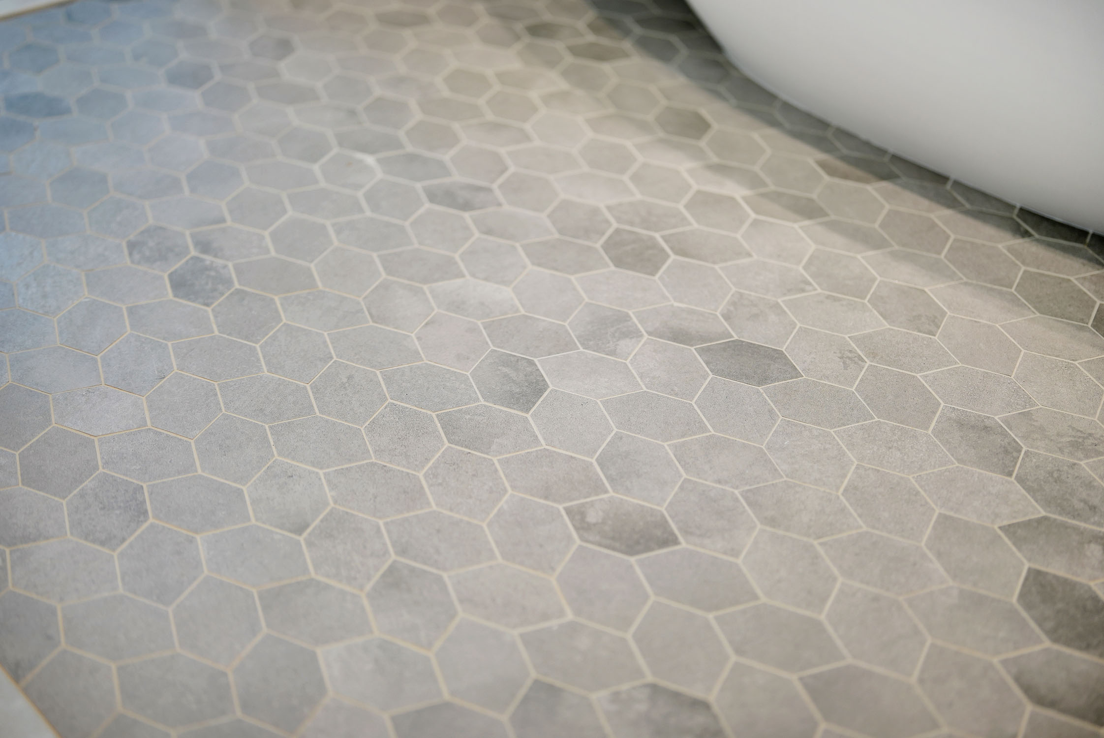 Light gray hexagon tile bathroom floor