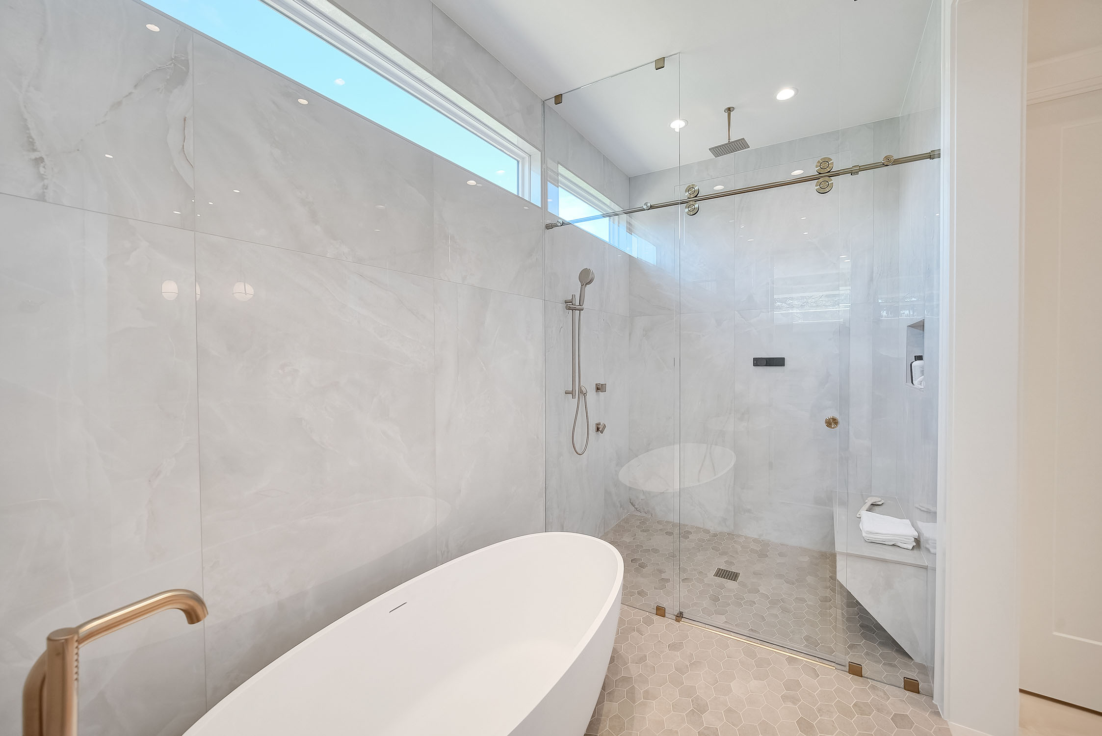 Modern bathroom with freestanding tub and glass shower