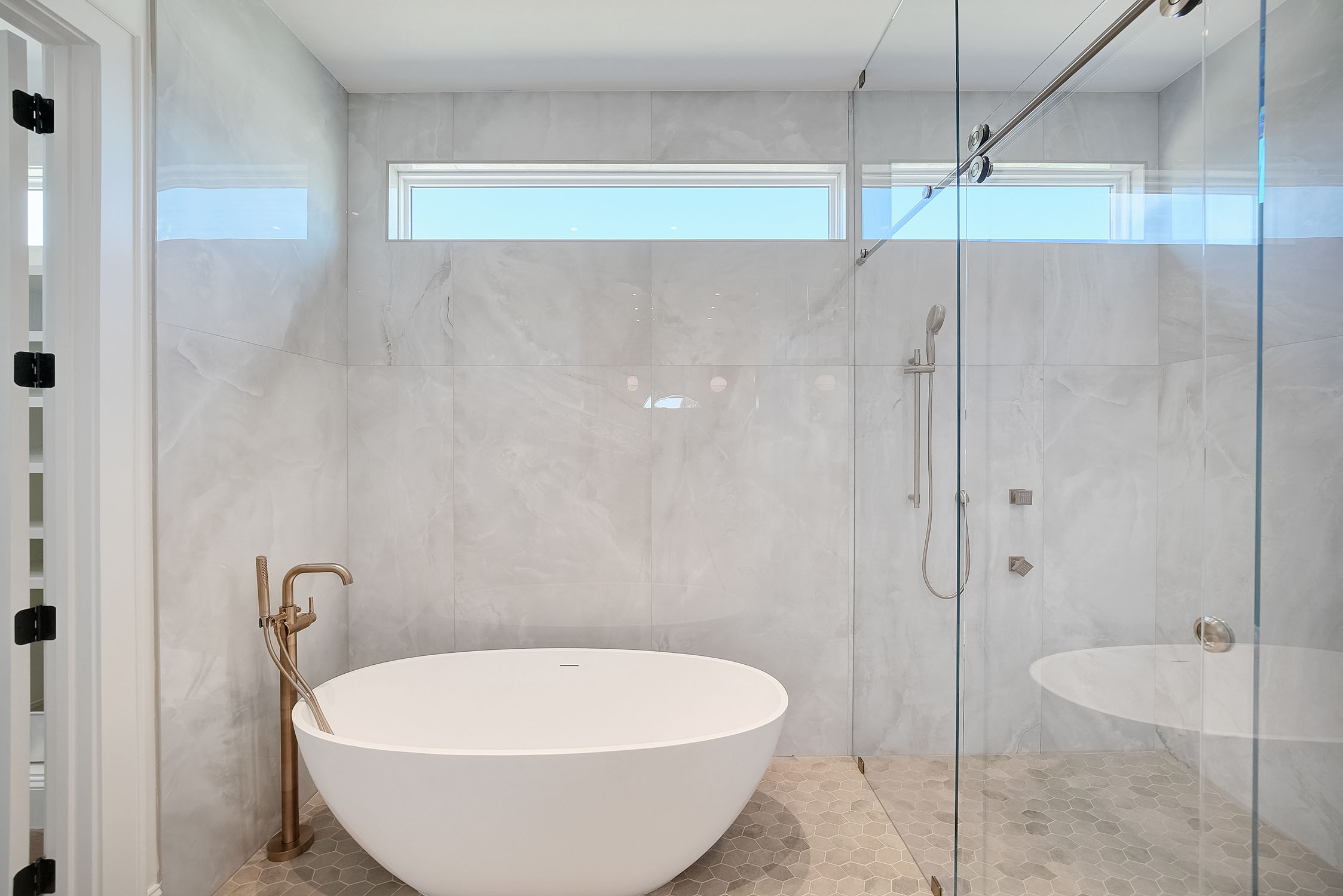 Modern bathroom with freestanding tub and glass shower