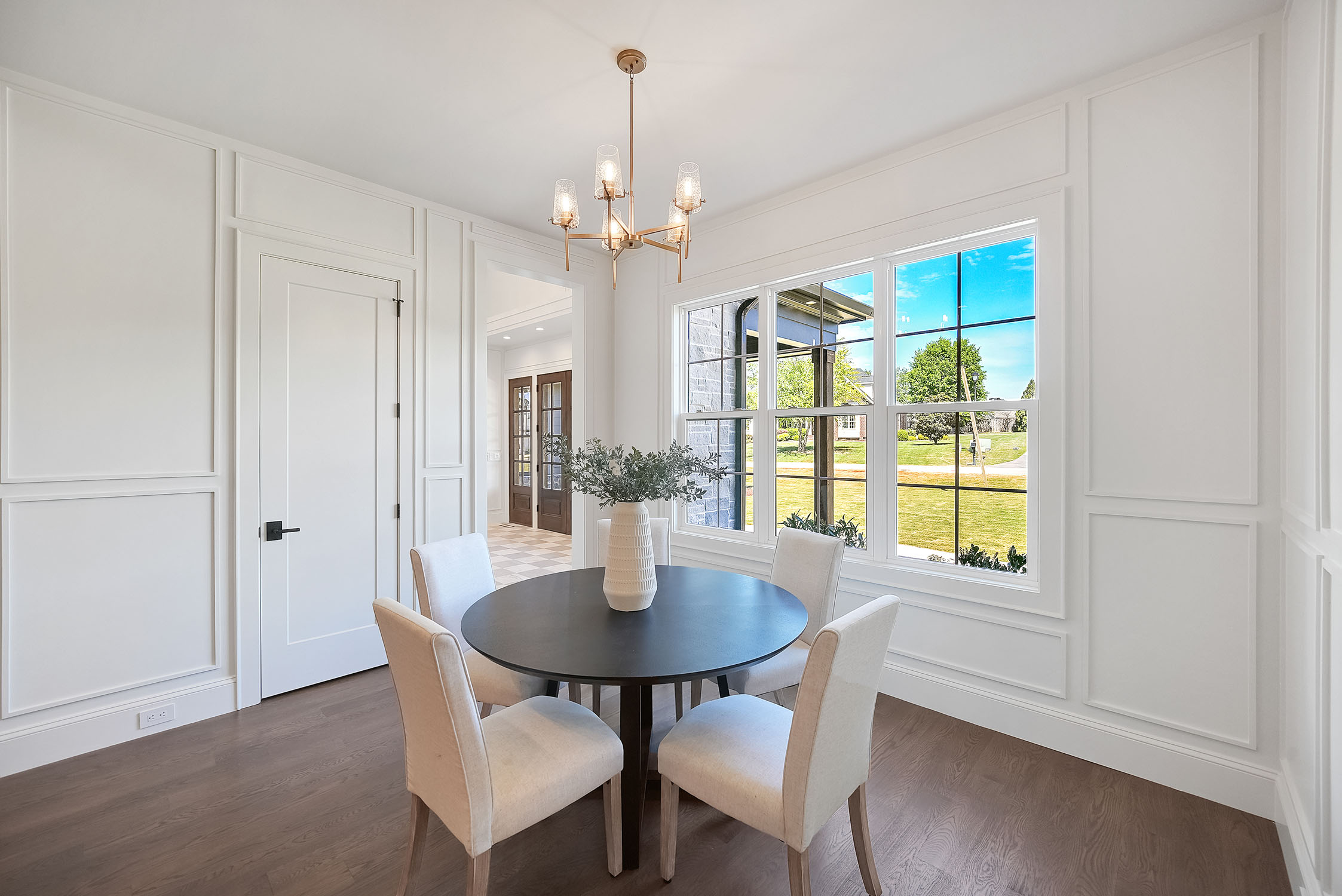 Bright modern dining room with round table