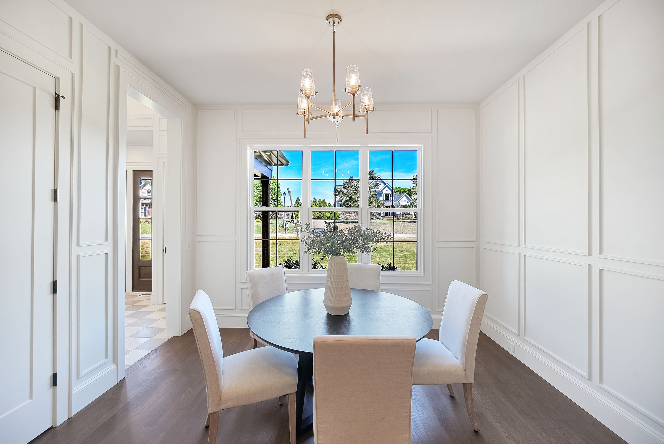 Bright modern dining room with round table