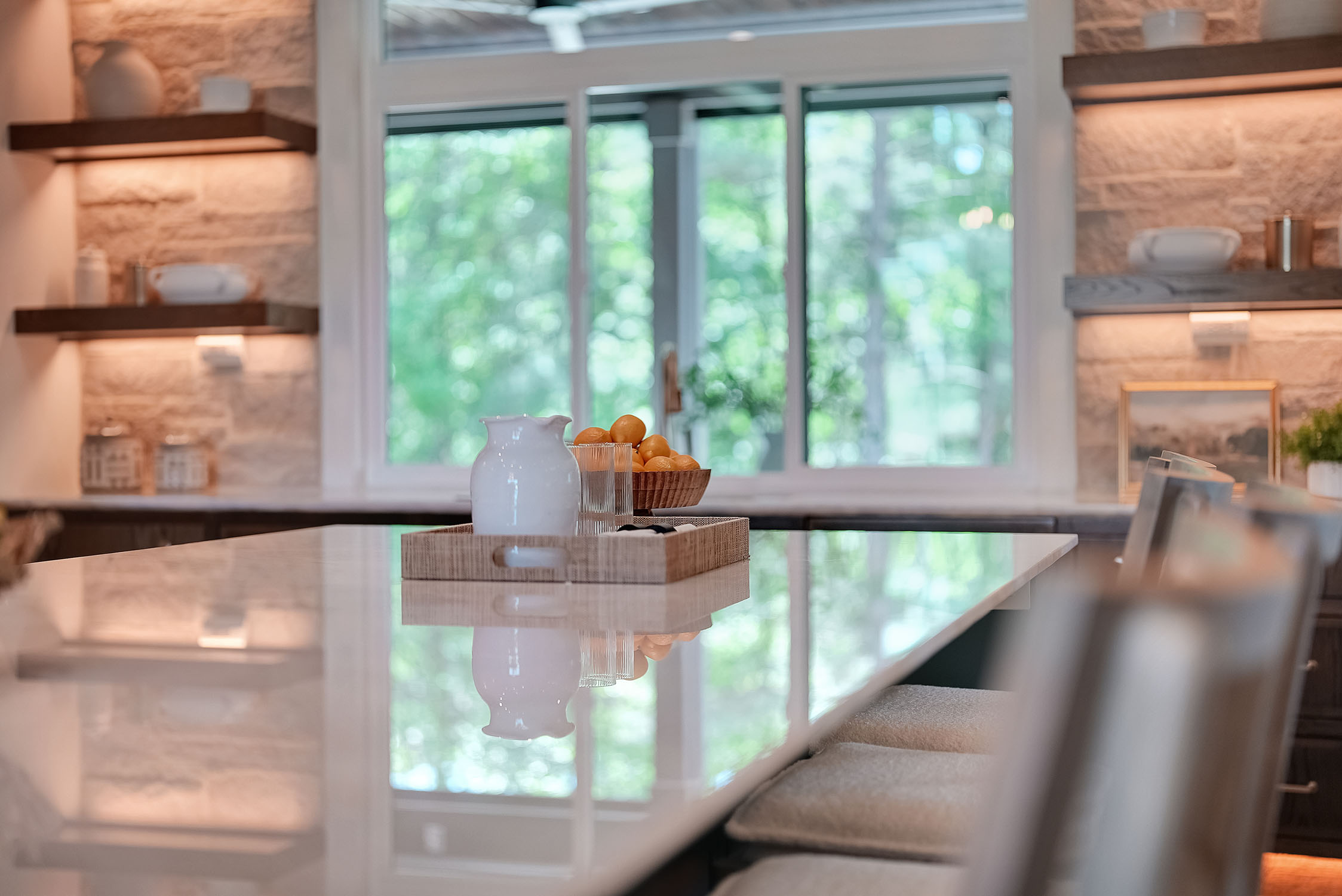 Modern kitchen island with pitcher and oranges