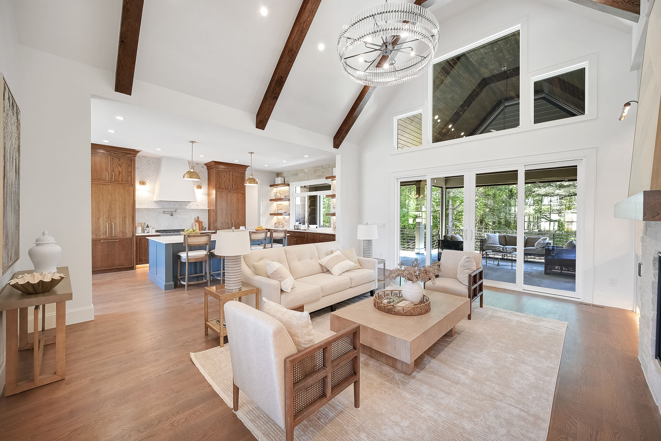 Modern open-concept living room and kitchen with vaulted ceiling