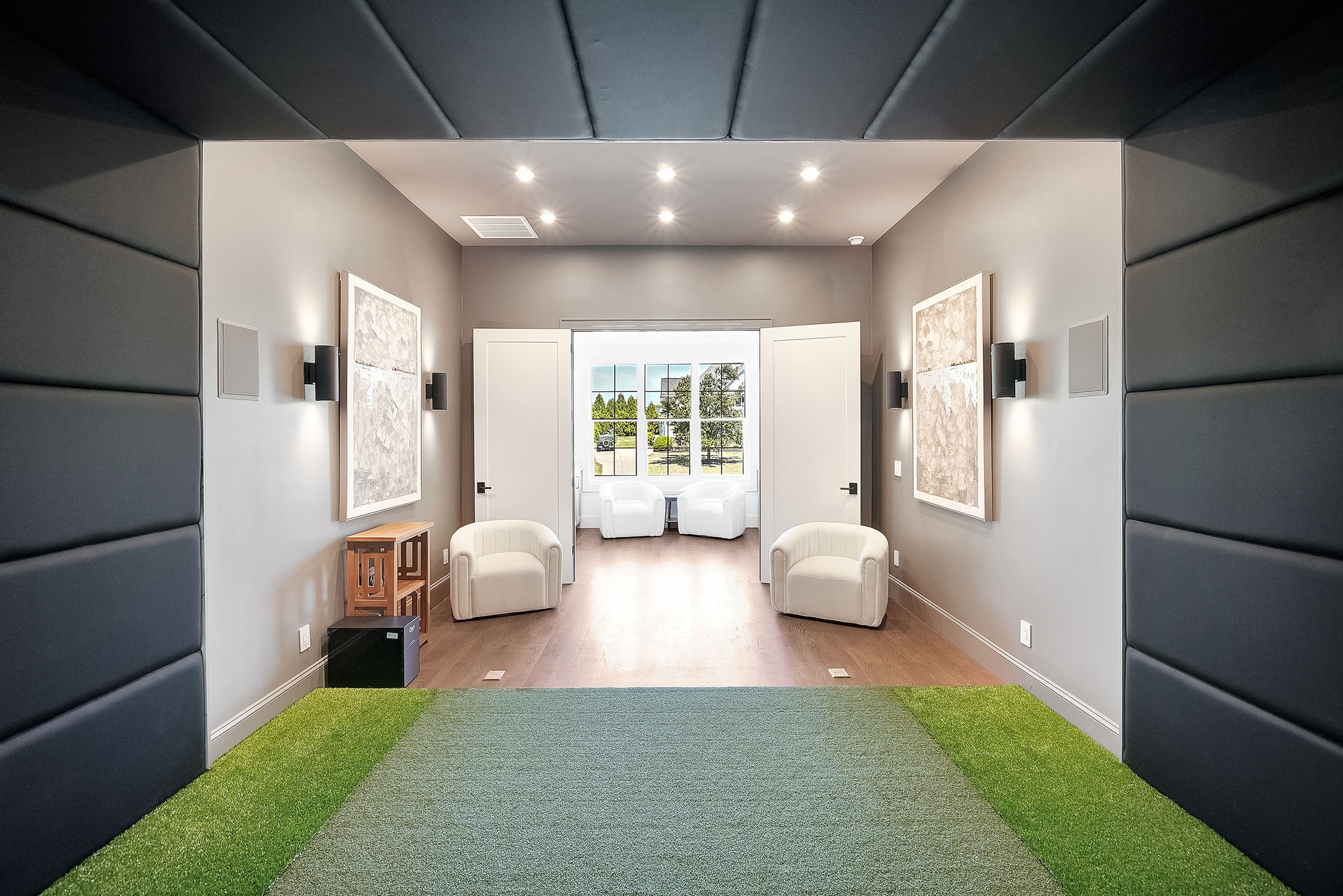 Modern padded lounge with chairs and open doors