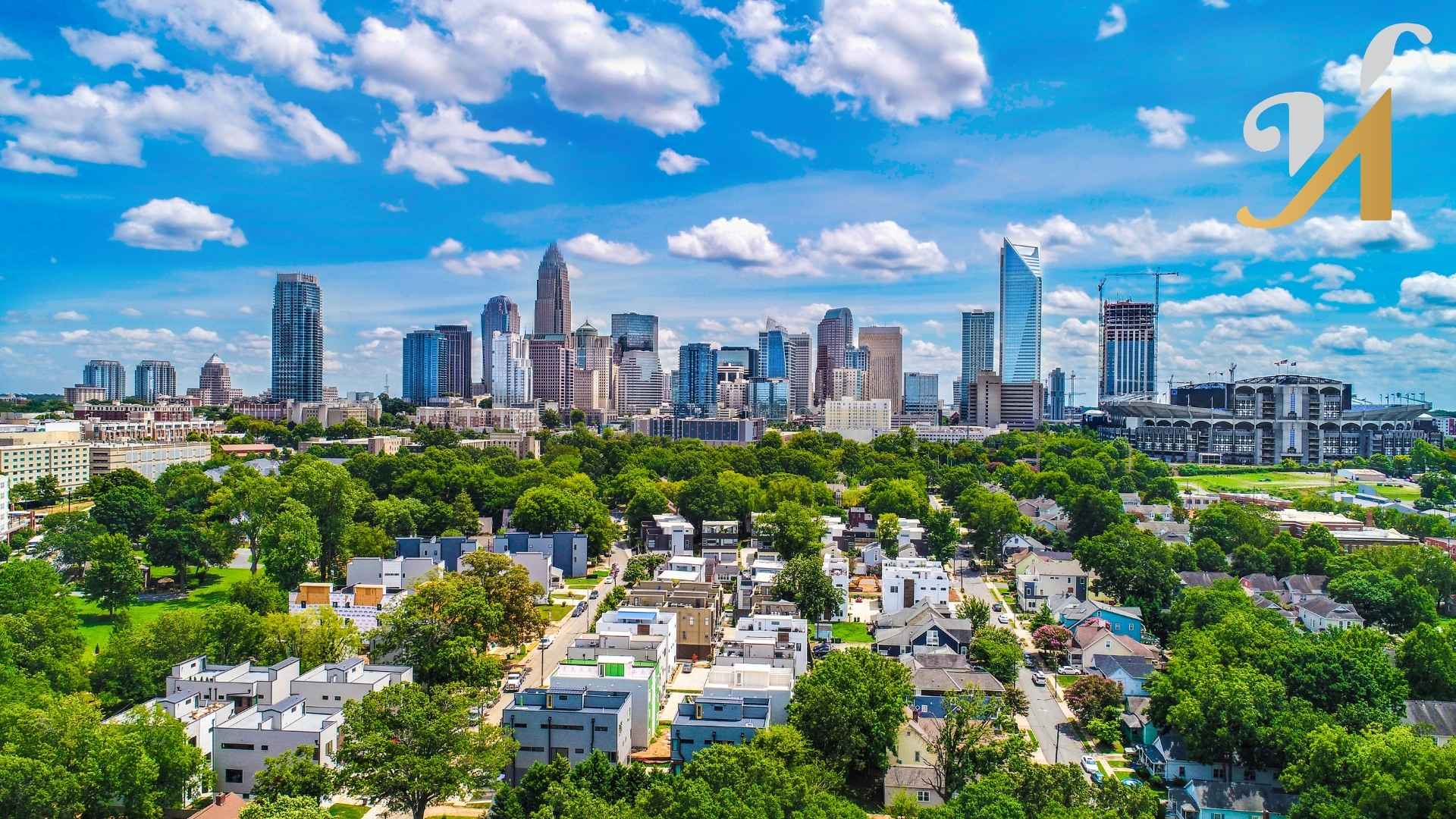 City skyline with trees and buildings under blue sky.