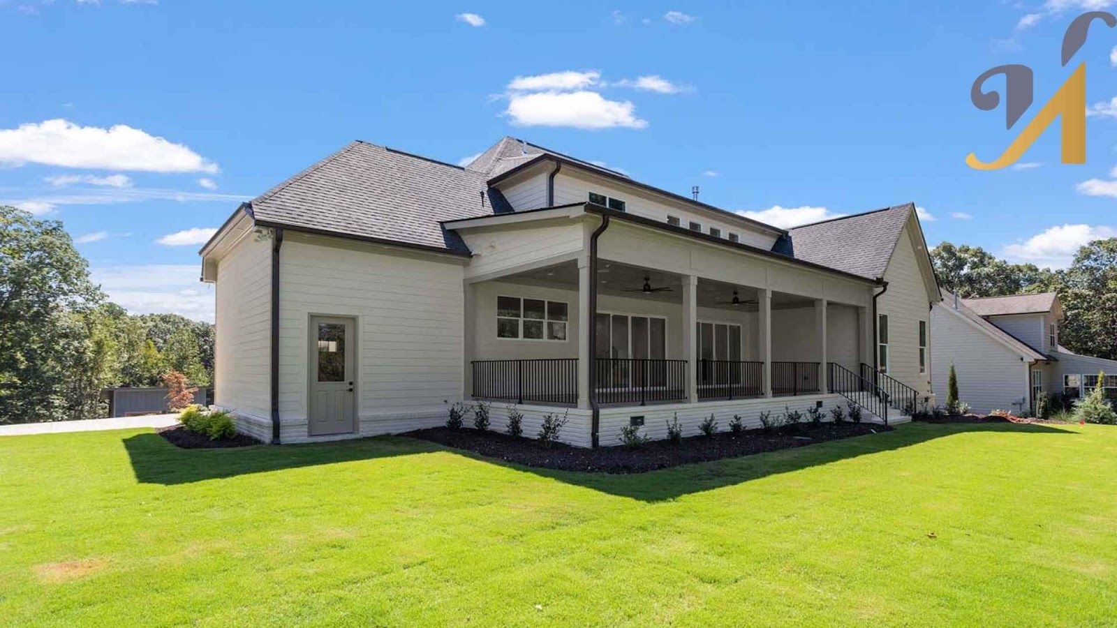 Modern house with spacious porch and lawn.