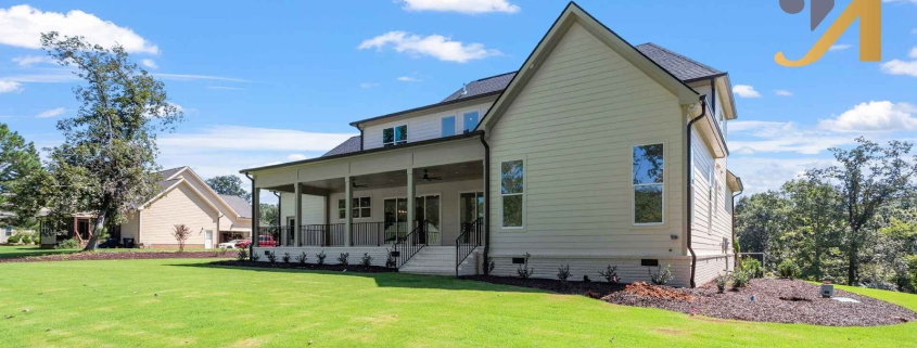 A custom-built home with a wide, open backyard and wraparound porch, designed to fit the land and natural light.