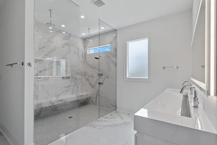 Modern bathroom with marble design and glass shower