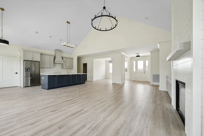 Spacious modern kitchen and living room with fireplace