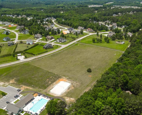 Aerial view of a suburban neighborhood with pool.