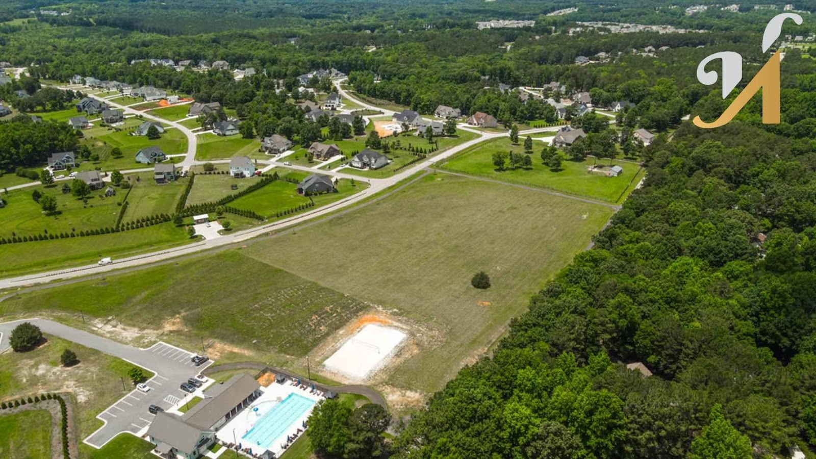 Aerial view of a suburban neighborhood with pool.