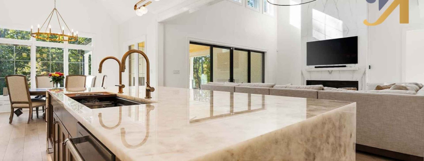 Modern kitchen countertop with elegant lighting and marble island.