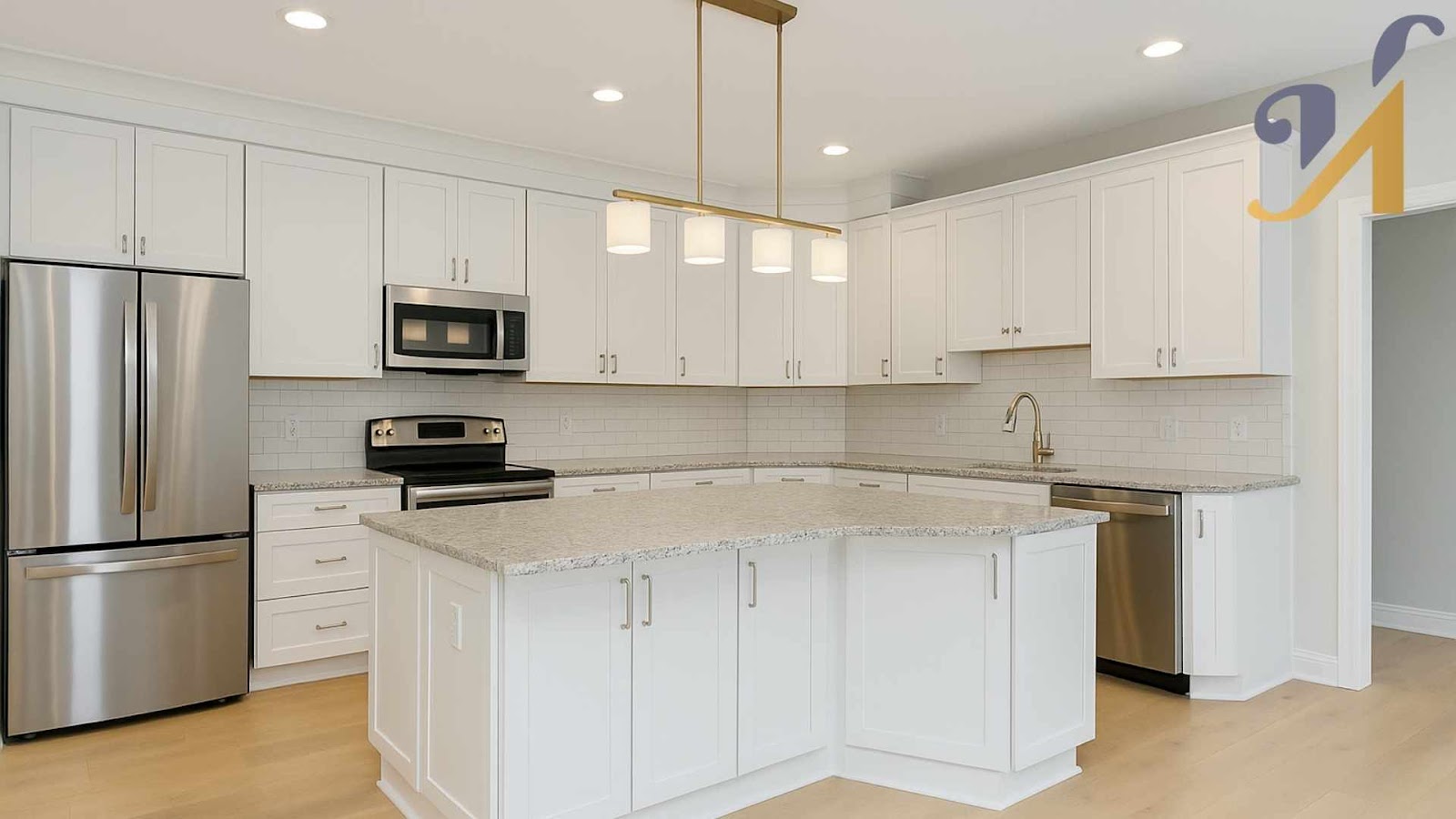 Modern U-shaped kitchen with white cabinets and stainless appliances.