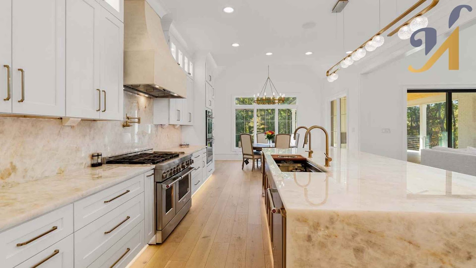 Modern gallery layout kitchen with marble countertops and dining area.