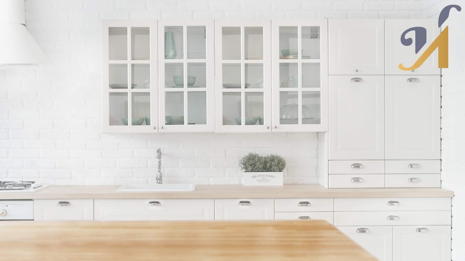 Modern one-wall white kitchen with glass cabinets.