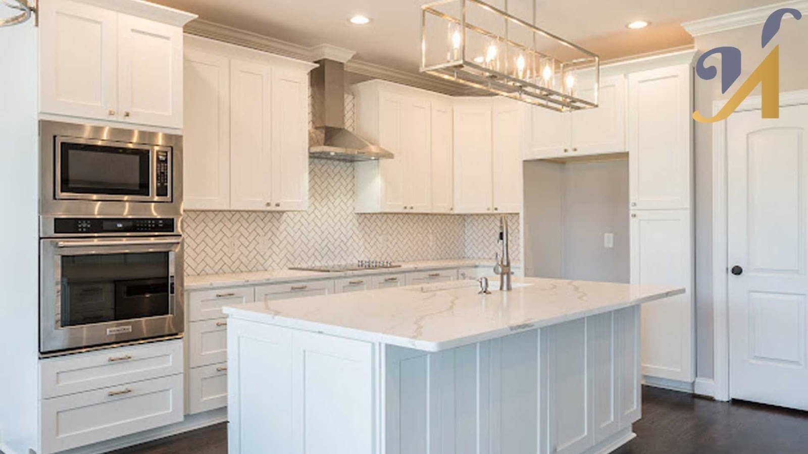 Modern island-layout kitchen with white cabinets and island
