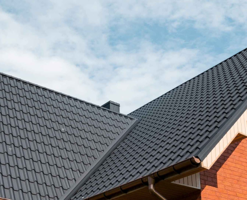 Modern house with black metal roofing.