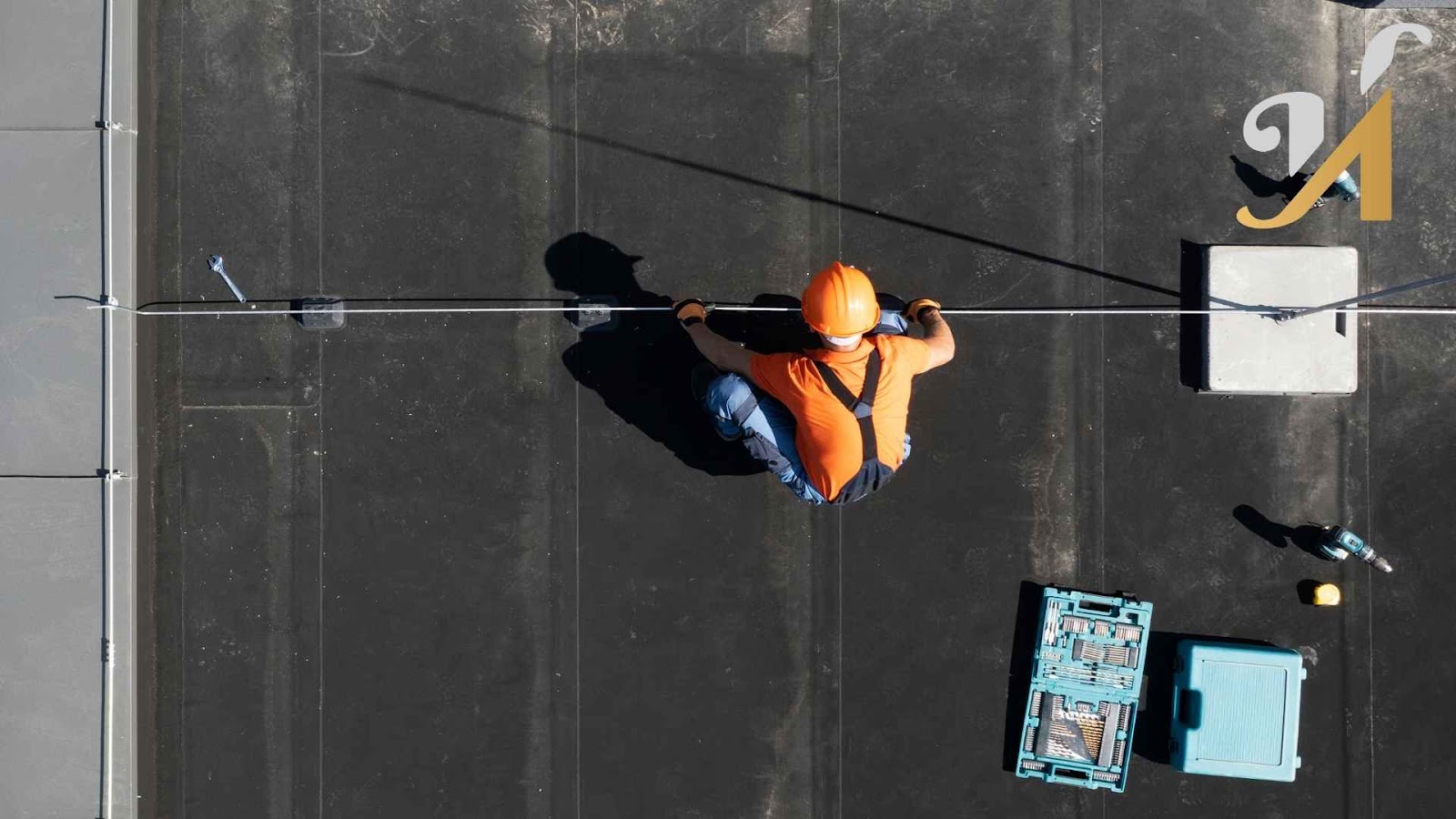Rooftop worker with tools and safety gear.
