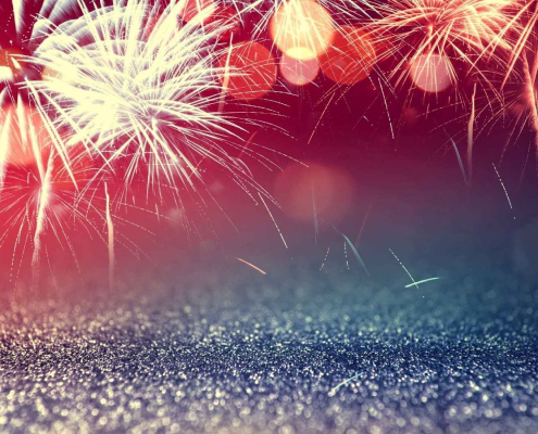 Colorful fireworks exploding in the night sky.