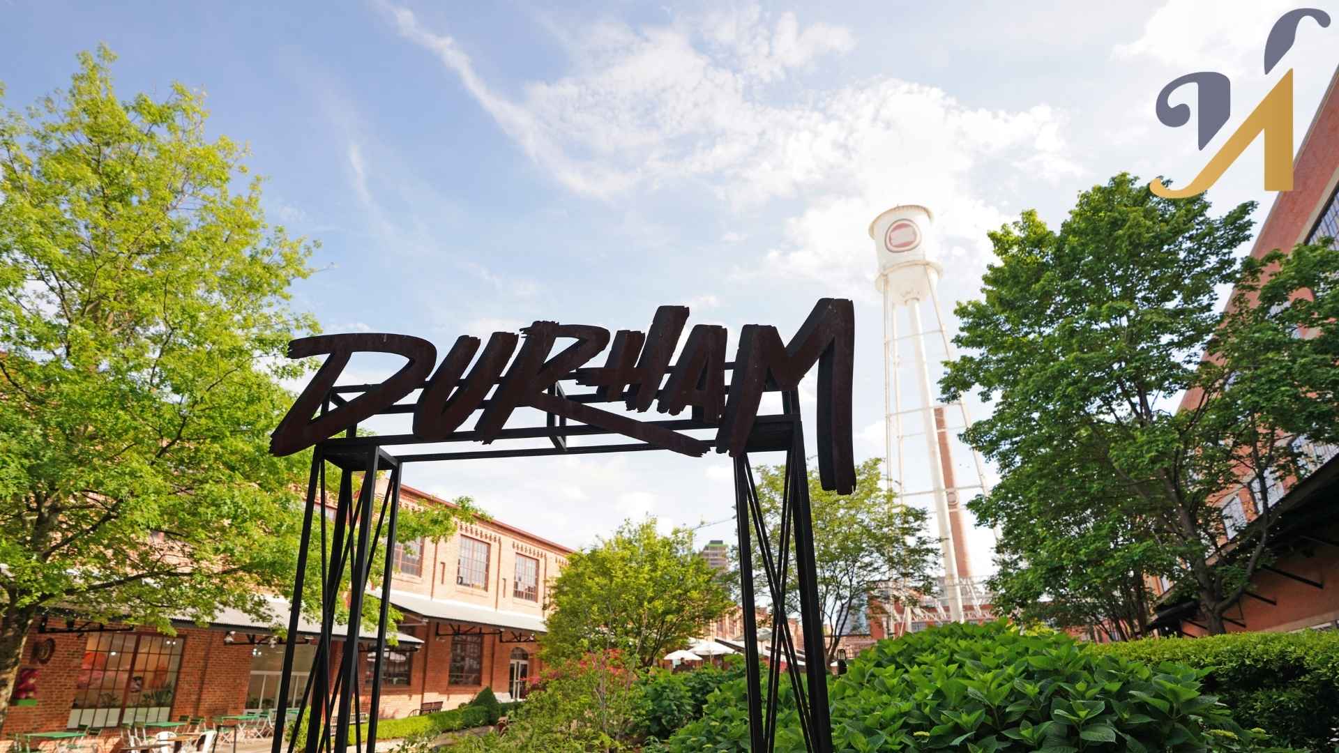 Durham sign with trees and brick buildings