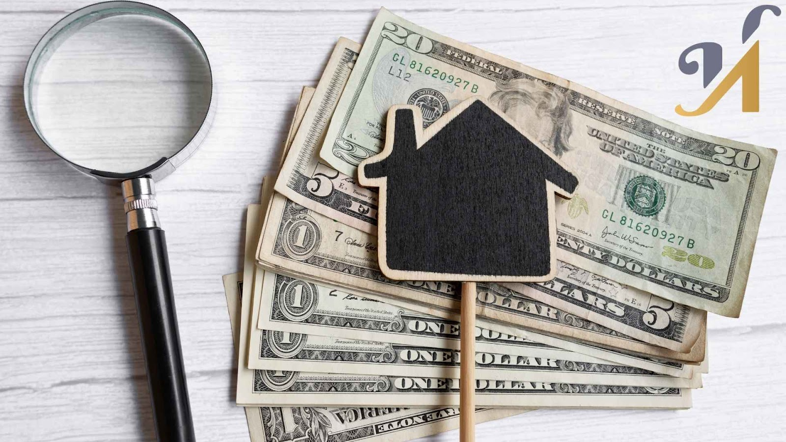 House shape, money, magnifying glass on desk
