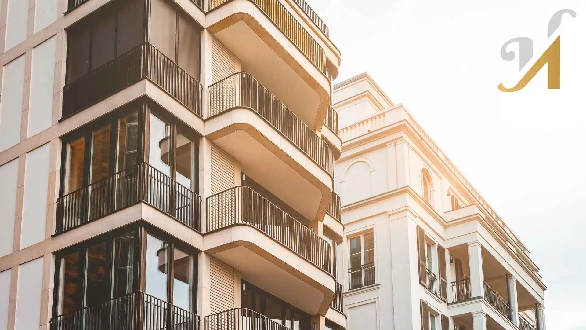 Modern apartment buildings with balconies at sunset