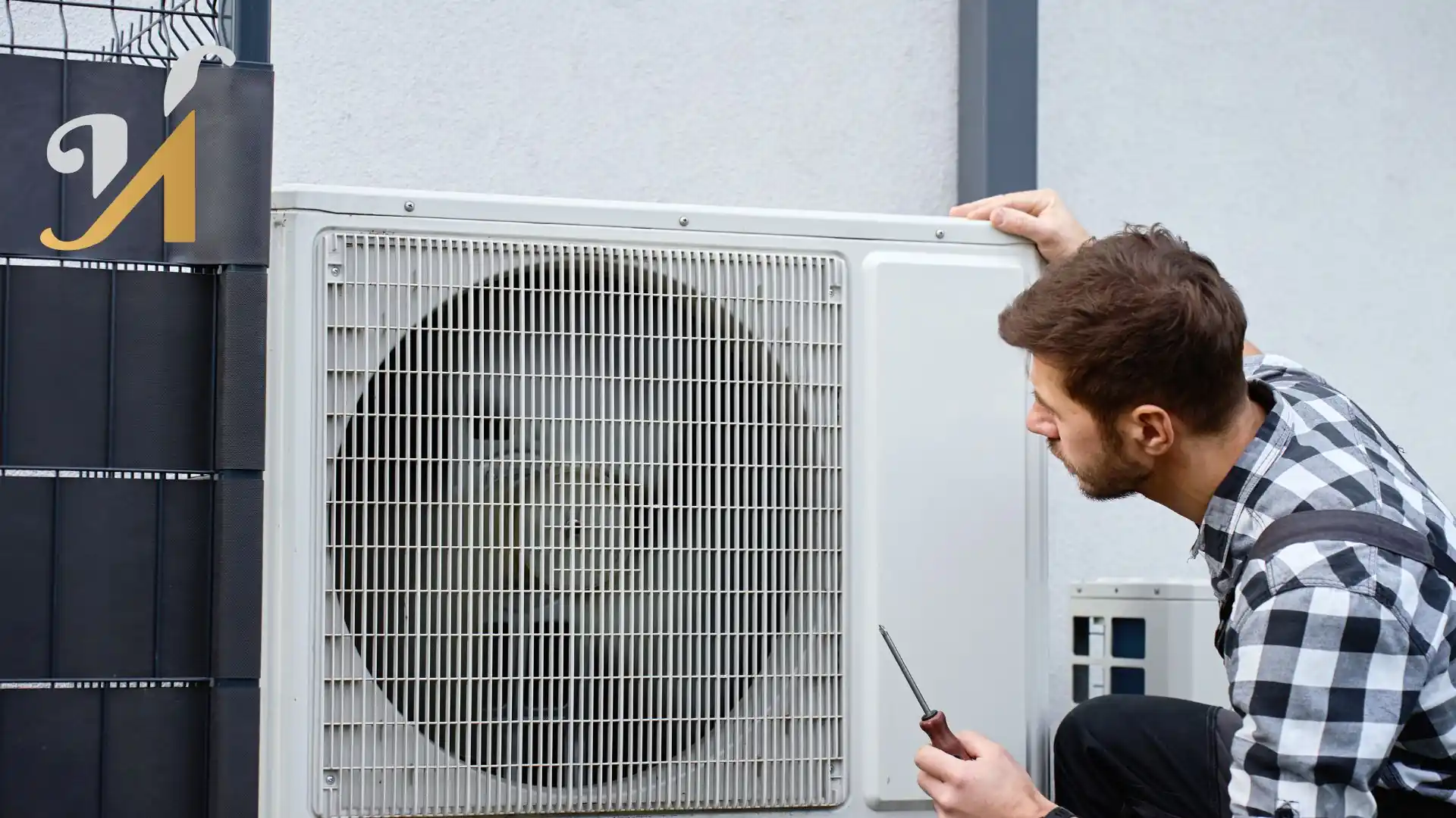 Technician examining outdoor HVAC unit after warranty claim call from custom home owner